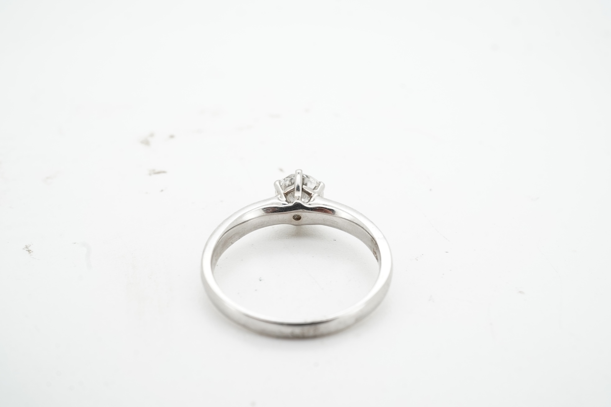 A diamond ring, claw-set with a brilliant-cut diamond weighing approximately 0.80 carats, mounted in white gold, size M, stamped 14K, gross weight approximately 3 grams